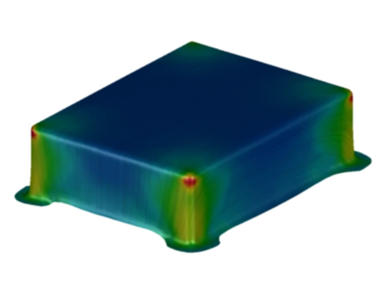 Ein 3D-Simulationsbild, das ein rechteckiges Objekt zeigt, bei dem die Spannungskonzentration an den Ecken rot hervorgehoben ist und über die Oberflächen in grün und blau übergeht, um niedrigere Spannungsbereiche anzuzeigen.